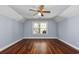 Spacious bedroom featuring hardwood floors, ceiling fan, and a window with natural light at 3604 Brampton Dr., Myrtle Beach, SC 29588