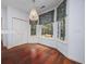 Cozy breakfast nook with hardwood floors and charming floral window treatments at 3604 Brampton Dr., Myrtle Beach, SC 29588