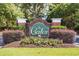 Elegant community entrance sign with brick pillars, lush landscaping, and welcoming signage at 3604 Brampton Dr., Myrtle Beach, SC 29588