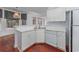 Bright kitchen features white cabinetry, modern appliances, and wood floors at 3604 Brampton Dr., Myrtle Beach, SC 29588