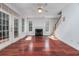 Spacious living room with hardwood floors and a fireplace, flooded with natural light at 3604 Brampton Dr., Myrtle Beach, SC 29588