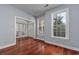 Open living room with hardwood floors, fireplace, and natural light at 3604 Brampton Dr., Myrtle Beach, SC 29588