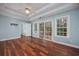 Main bedroom with sliding glass door to deck and tray ceilings at 3604 Brampton Dr., Myrtle Beach, SC 29588