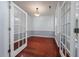 Office with glass French doors, hardwood floors, and plenty of natural light at 3604 Brampton Dr., Myrtle Beach, SC 29588