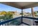 Balcony featuring views of palm trees, other buildings, and a swimming pool at 405 21St Ave. S # 2H, North Myrtle Beach, SC 29582