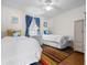 Bright bedroom featuring two twin beds with nautical decor and a light-colored dresser at 405 21St Ave. S # 2H, North Myrtle Beach, SC 29582