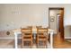 Bright dining area featuring tile floors, seating for four, and an open doorway to the next room at 405 21St Ave. S # 2H, North Myrtle Beach, SC 29582