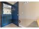 This is an entryway to a residence with a blue door and tile flooring at 405 21St Ave. S # 2H, North Myrtle Beach, SC 29582