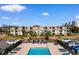 Aerial view of a condo complex and a swimming pool with lounge chairs nearby at 405 21St Ave. S # 2H, North Myrtle Beach, SC 29582