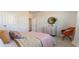 Bright bedroom featuring a cozy bed, modern dresser, and stylish chair with gold legs at 423 Clear Lake Dr., Conway, SC 29526