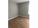 Empty bedroom with wood-look floors, neutral paint, and bright window at 4390 Daphne Ln. # D, Murrells Inlet, SC 29576