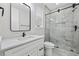 Modern bathroom featuring glass enclosed shower, sleek vanity with marble countertop, and contemporary fixtures at 5368 Ocean Village Dr., Myrtle Beach, SC 29577