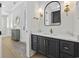 Stylish bathroom featuring dark vanity with white marble countertop, gold hardware, and modern light fixtures at 5368 Ocean Village Dr., Myrtle Beach, SC 29577
