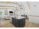 Bright, open-concept kitchen featuring a large island with pendant lighting and modern appliances at 5368 Ocean Village Dr., Myrtle Beach, SC 29577