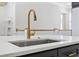 Close up of kitchen island with gold faucet and stainless steel sink at 5368 Ocean Village Dr., Myrtle Beach, SC 29577