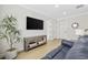 Well-lit living room showcases stylish decor, a mounted TV, and ample space for relaxation at 5368 Ocean Village Dr., Myrtle Beach, SC 29577