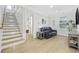 Inviting living room features light hardwood floors, recessed lighting, and a comfortable sofa at 5368 Ocean Village Dr., Myrtle Beach, SC 29577
