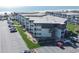 An aerial view of a multi-story condo building with parking and ocean views at 5601 N Ocean Blvd. # B306, Myrtle Beach, SC 29577
