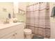 Well-lit bathroom features a vanity, commode and shower at 5601 N Ocean Blvd. # B306, Myrtle Beach, SC 29577