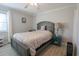 Relaxing bedroom boasts a comfortable bed, side tables, and ample natural light at 5601 N Ocean Blvd. # B306, Myrtle Beach, SC 29577
