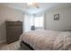 This cozy bedroom boasts a comfortable bed, dresser and an abundance of natural light at 5601 N Ocean Blvd. # B306, Myrtle Beach, SC 29577