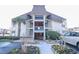 A front exterior view of a condo building with a well-kept landscape at 5601 N Ocean Blvd. # B306, Myrtle Beach, SC 29577