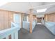 Hallway leading to units, with white walls and blue railings at 5601 N Ocean Blvd. # B306, Myrtle Beach, SC 29577