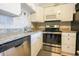 Modern kitchen featuring stainless steel appliances, granite countertops, and updated fixtures at 5601 N Ocean Blvd. # B306, Myrtle Beach, SC 29577