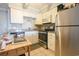 A functional kitchen with stainless steel appliances, granite counters, and ample storage at 5601 N Ocean Blvd. # B306, Myrtle Beach, SC 29577