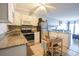 Bright kitchen equipped with stainless steel appliances, granite countertops, and functional island at 5601 N Ocean Blvd. # B306, Myrtle Beach, SC 29577