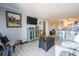 The cozy living room has a seamless layout into the kitchen with barstool seating at 5601 N Ocean Blvd. # B306, Myrtle Beach, SC 29577