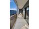 Outdoor balcony with white chairs offering views of the beach and the neighborhood at 5905 S Kings Highway # 432-A, Myrtle Beach, SC 29575
