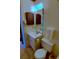 Quaint bathroom showcasing wood shuttered medicine cabinet, small vanity, and toilet at 5905 S Kings Highway # 432-A, Myrtle Beach, SC 29575