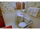 Classic bathroom features a toilet, sink vanity, and dark wood shuttered mirror at 5905 S Kings Highway # 432-A, Myrtle Beach, SC 29575