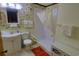 Functional bathroom with tub shower combo, white sink vanity, and colorful fish themed wallpaper at 5905 S Kings Highway # 432-A, Myrtle Beach, SC 29575