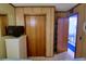 Bedroom showcasing closet, dresser, and doorway to another room with blue carpet at 5905 S Kings Highway # 432-A, Myrtle Beach, SC 29575