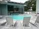 Community pool area with lounge chairs for relaxing poolside at 5905 S Kings Highway # 432-A, Myrtle Beach, SC 29575