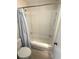 Full bathroom features a tub with shower and blue floral shower curtain at 5905 South Kings Hwy. # 1116, Myrtle Beach, SC 29575