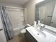 Bright bathroom featuring a shower-tub combo and single sink vanity at 5905 South Kings Hwy. # 1116, Myrtle Beach, SC 29575