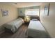 Cozy bedroom featuring two twin beds, neutral walls, and natural light at 5905 South Kings Hwy. # 1116, Myrtle Beach, SC 29575