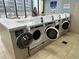 Well-lit laundry room features multiple front-load washers for resident convenience at 5905 South Kings Hwy. # 1116, Myrtle Beach, SC 29575
