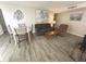 Bright living room featuring hardwood floors, sofa, and dining table at 5905 South Kings Hwy. # 1116, Myrtle Beach, SC 29575