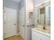 Well-lit bathroom featuring a white vanity, decorative mirror, and tiled flooring for a clean and stylish design at 6001 - 1527 S Kings Hwy., Myrtle Beach, SC 29575