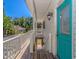 Side deck leading to additional outdoor space, with stairs to the ground floor, and a vibrant turquoise door at 6001 - 1527 S Kings Hwy., Myrtle Beach, SC 29575