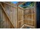 Rustic outdoor shower featuring wood enclosure, shower head, and built-in shelving at 6001 - 1527 S Kings Hwy., Myrtle Beach, SC 29575