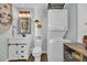 Nautical-themed bathroom featuring vanity, toilet, washer, and dryer at 6001-5124 S Kings Hwy., Myrtle Beach, SC 29575