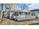 Quaint gray home featuring a cozy front porch and well-maintained exterior in a charming setting at 6001-5124 S Kings Hwy., Myrtle Beach, SC 29575