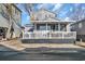 Charming single-story home featuring a lovely front porch and well-maintained landscaping at 6001-5124 S Kings Hwy., Myrtle Beach, SC 29575