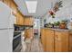 Functional kitchen with wood cabinets and adjacent bedroom view at 6001-5124 S Kings Hwy., Myrtle Beach, SC 29575