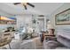 Inviting living room with cozy seating, TV, and charming beach-themed decorations at 6001-5124 S Kings Hwy., Myrtle Beach, SC 29575